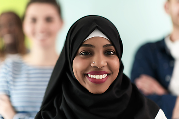 Image showing group of diverse teenagers posing in a studio, determined teenagers in diverse clothing.