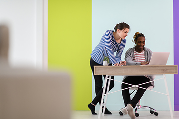 Image showing merican and a young girl plan meetings together and use a laptop for an online meeting