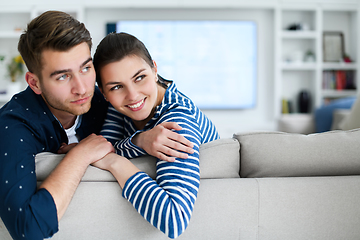 Image showing a young married couple enjoys sitting in the large living room