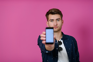 Image showing covid passport a young man shows his qr code and covid19 passport on his cell phone