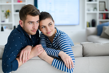 Image showing a young married couple enjoys sitting in the large living room