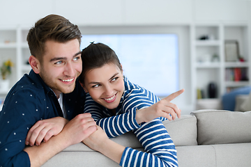 Image showing a young married couple enjoys sitting in the large living room