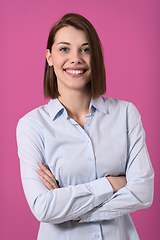 Image showing Portrati shot of beautiful blond businesswoman standing with arms crossed at isolated white background.
