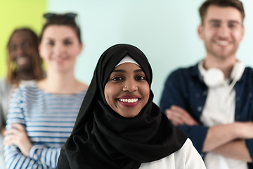 Image showing group of diverse teenagers posing in a studio, determined teenagers in diverse clothing.