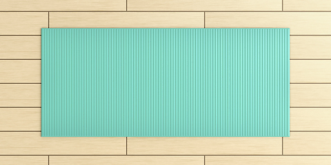 Image showing Exercise mat on wood floor
