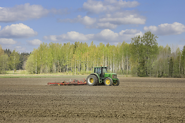 Image showing John Deere Tractor and Harrow Agricultural Landscape