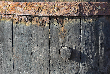 Image showing Texture of very old barrel for wine with a cork and a rusty meta