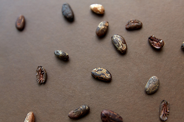 Image showing cocoa beans on brown background