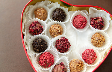 Image showing candies in red heart shaped chocolate box