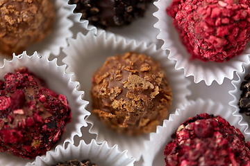 Image showing close up of different candies in paper cups