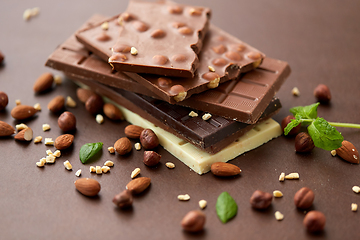 Image showing close up of different chocolate bars and nuts