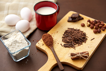 Image showing chocolate, cocoa powder, milk, eggs and flour