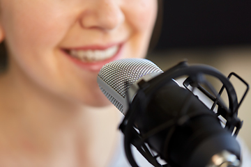 Image showing close up of woman talking to microphone