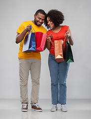 Image showing happy african american couple with shopping bags