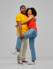 Image showing scared african american couple hugging