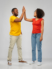 Image showing happy african american couple making high five