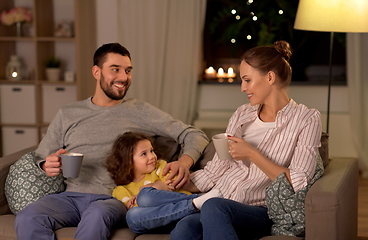 Image showing portrait of happy family sitting on sofa at home