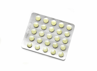 Image showing Yellow pills packed in blister on white background