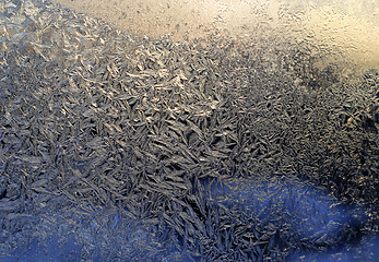 Image showing Beautiful ice pattern and sunlight close-up on winter glass