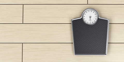 Image showing Weighing scale on wood floor