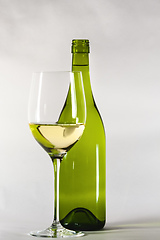 Image showing white wine bottle with a glass