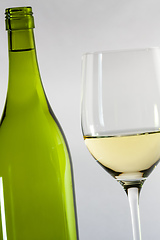 Image showing white wine bottle with a glass