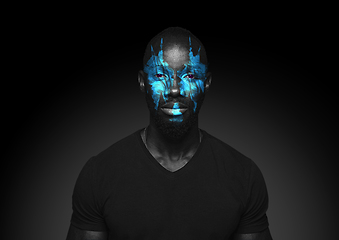 Image showing Close up portrait of young man isolated on black studio background