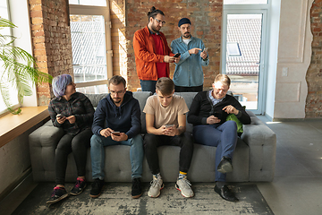 Image showing Group of happy young people sharing in social media