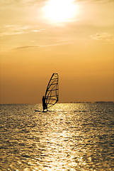 Image showing Silhouette of a windsurfer on a sunset