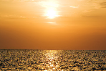 Image showing Orange sunset above a quiet serene gulf