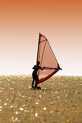 Image showing Silhouette a women on a windsurf on waves
