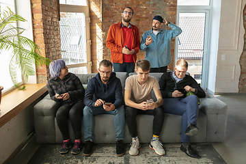 Image showing Group of happy young people sharing in social media