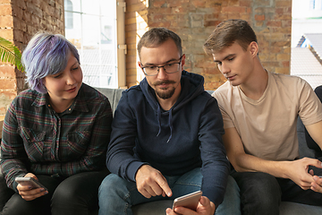 Image showing Group of happy young people sharing in social media