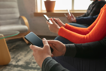 Image showing Close up hands of group of happy young people sharing in social media