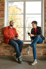 Image showing Happy young man and woman sharing in social media