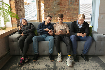 Image showing Group of happy young people sharing in social media