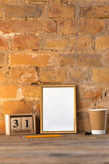 Image showing Mock up blank picture or sheet on the brick wall background