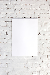 Image showing Mock up blank picture or sheet on the brick wall background