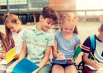 Image showing group of happy elementary school students outdoors