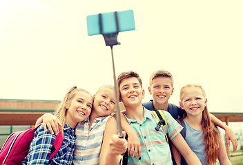 Image showing happy elementary school students taking selfie