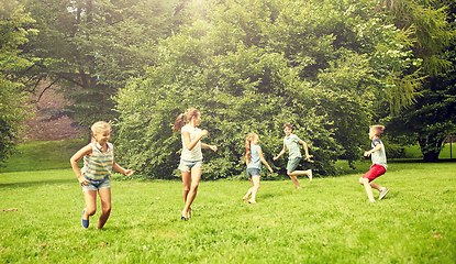 Image showing happy kids running and playing game outdoors