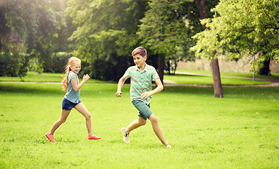 Image showing happy kids running and playing game outdoors