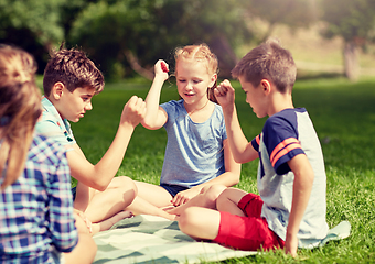 Image showing happy kids playing rock-paper-scissors game