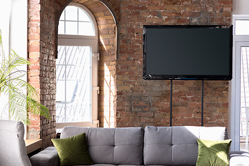 Image showing Mock up blank television screen on the brick wall background