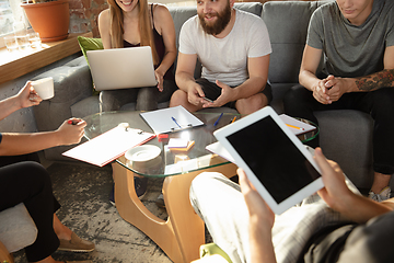 Image showing Group of young caucasian office workers have creative meeting to discuss new ideas