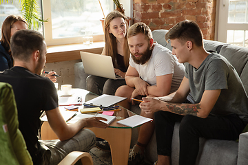 Image showing Group of young caucasian office workers have creative meeting to discuss new ideas