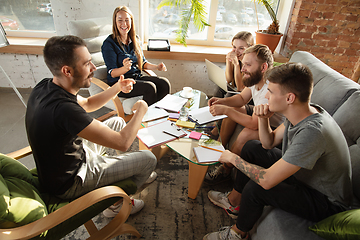 Image showing Group of young caucasian office workers have creative meeting to discuss new ideas