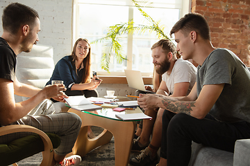 Image showing Group of young caucasian office workers have creative meeting to discuss new ideas