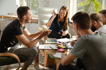 Image showing Group of young caucasian office workers have creative meeting to discuss new ideas