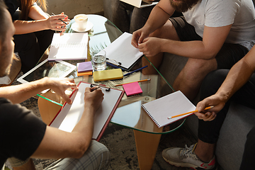 Image showing Group of young caucasian office workers have creative meeting to discuss new ideas